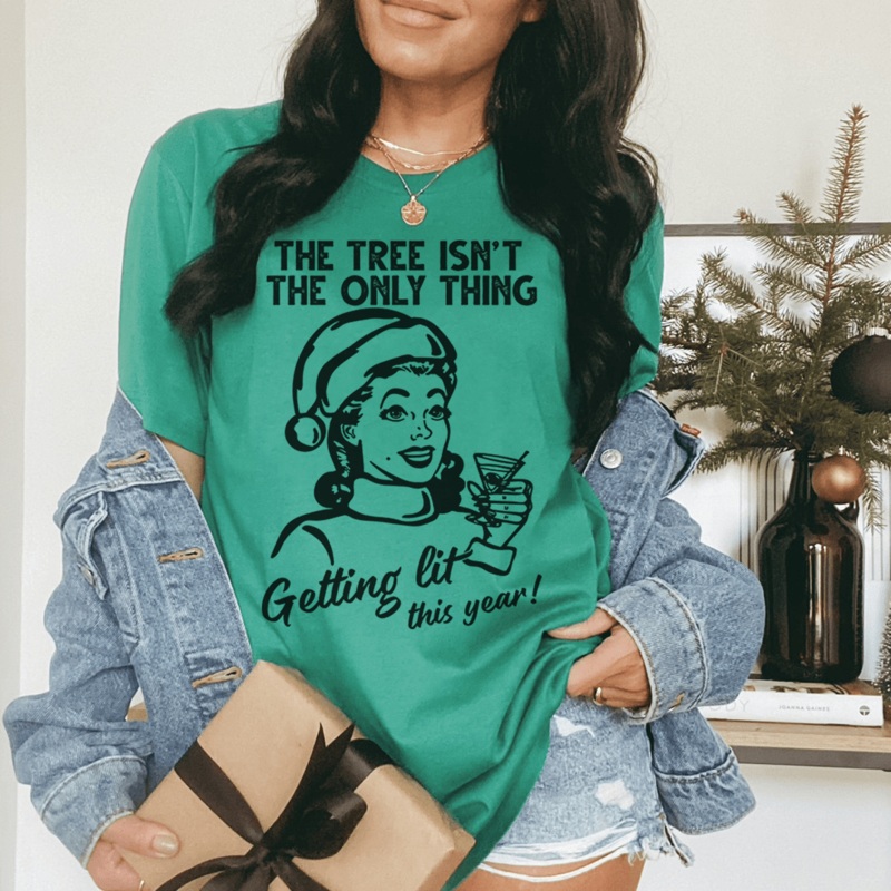 The Tree Isn’t The Only One Getting Lit This Year Tee Kelly S