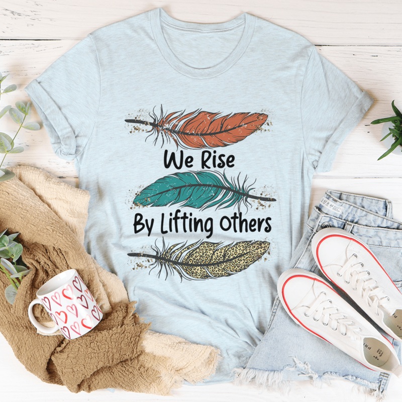 We Rise By Lifting Others Tee Heather Prism Ice Blue S