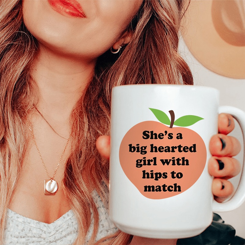 She’s A Big Hearted Girl With Hips to Match Ceramic Mug 15 oz White One Size
